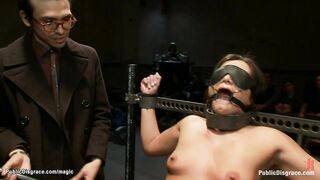 Bound slave sucks big cocks in public