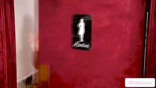 Milf licks a blonde in a public restroom