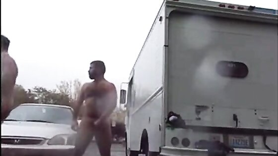 Public Rainy Stroking in a Parking Lot by Two Horny Men