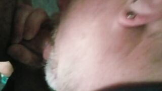 Choked on cock, covered in cum.